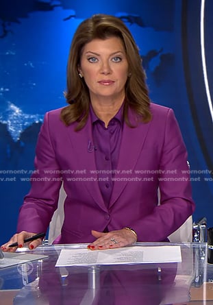 Norah’s purple tie neck blouse and suit on CBS Evening News