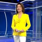 Norah’s yellow blazer and white flare pants on CBS Evening News