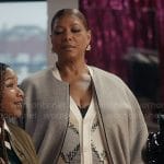 Robyn’s grey bomber jacket and printed cardigan on The Equalizer
