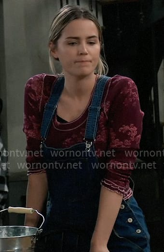 Sasha’s purple and pink printed top with denim overalls on General Hospital