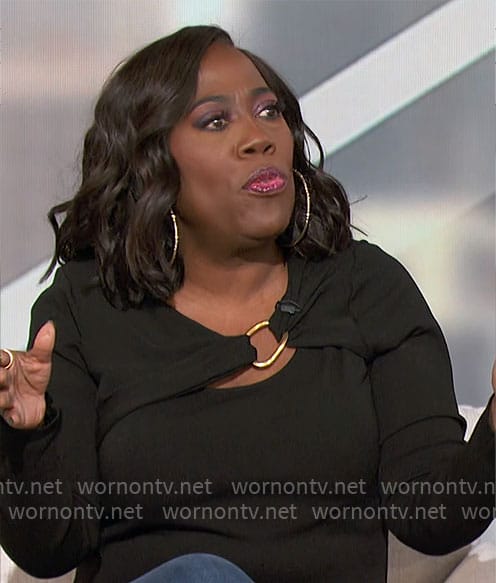 Sheryl’s black top with gold ring detail on The Talk
