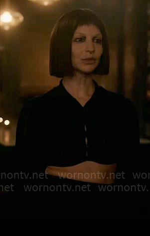 Sonia’s black cropped top and green spiked heels on American Horror Story Delicate