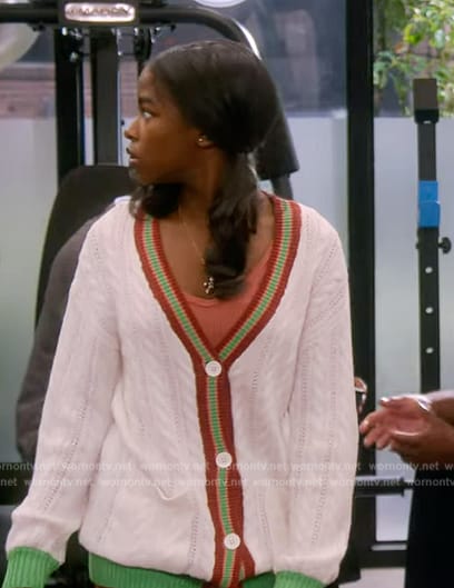 Sydney’s white stripe trim cable knit cardigan on The Upshaws