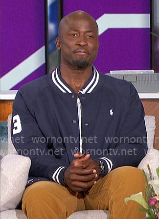 Akbar’s navy bomber jacket on The Talk