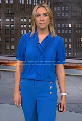 Alex Wilson’s blue tie neck top and pants on CBS Evening News