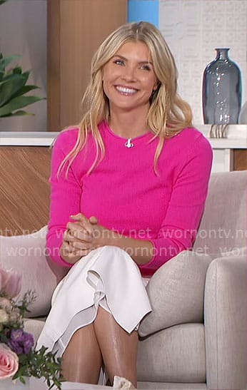 Amanda’s pink sweater and white faux leather skirt on The Talk