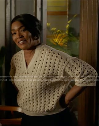 Athena’s white open knit v-neck sweater on 9-1-1