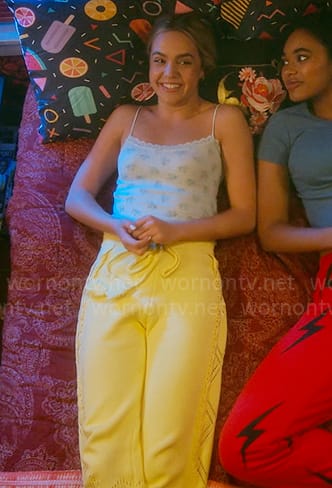 Imogen’s floral lace-trim cami and yellow knit pants on Pretty Little Liars Original Sin