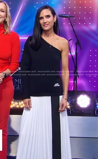 Jennifer Connelly’s black one-shoulder top and white pleated skirt on Good Morning America