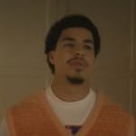 Andre’s orange knit vest on Grown-ish