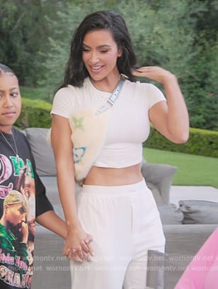 Kim’s white crop tee and bag on The Kardashians