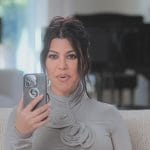 Kourtney’s floral applique confessional dress on The Kardashians