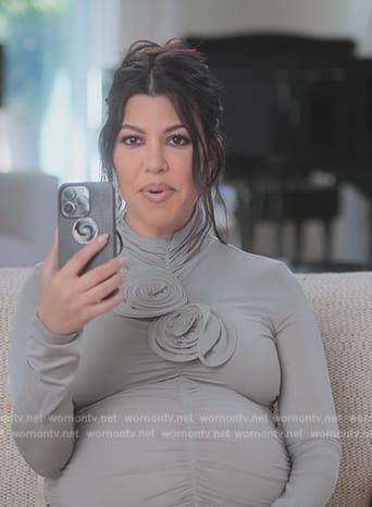 Kourtney’s floral applique confessional dress on The Kardashians