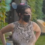 Kourtney’s snake skin print top and pants on The Kardashians