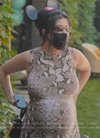 Kourtney’s snake skin print top and pants on The Kardashians