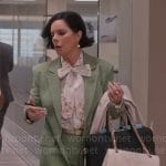 Margaret’s floral tie neck blouse and green suit on So Help Me Todd
