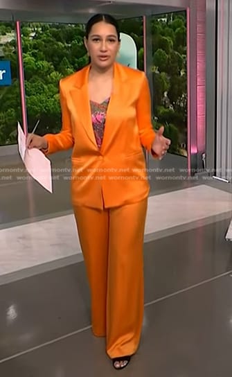 Morgan’s pink paisley print cami and orange suit on NBC News Daily