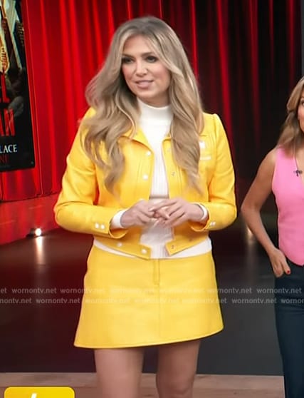 Nikki Novak’s yellow leather jacket and mini skirt on Access Hollywood