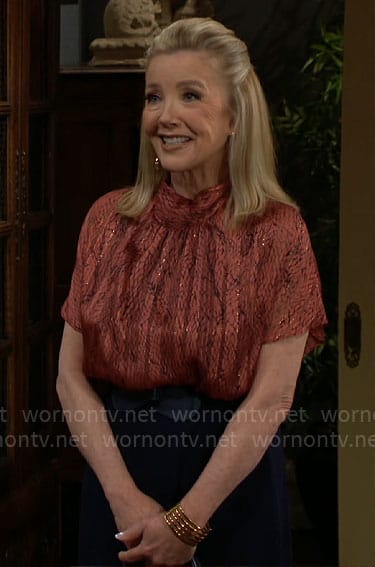 Nikki’s red blouse and navy pants jumpsuit on The Young and the Restless