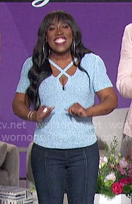 Sheryl’s blue knit criss cross top on The Talk