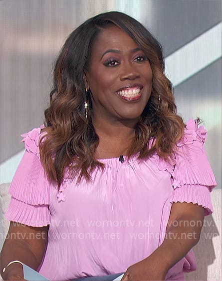 Sheryl’s pink off shoulder top on The Talk