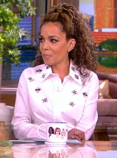 Sunny’s white embellished blouse and ruffle skirt on The View