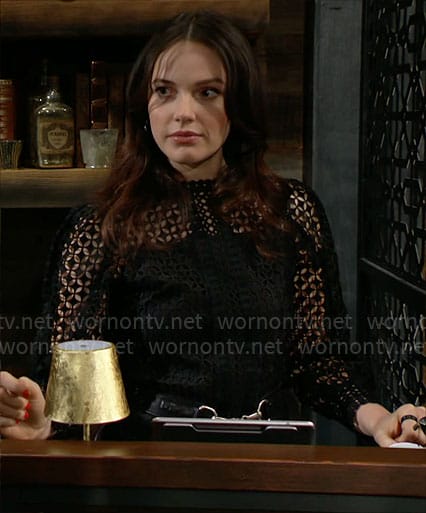 Tessa’s black lace top on The Young and the Restless