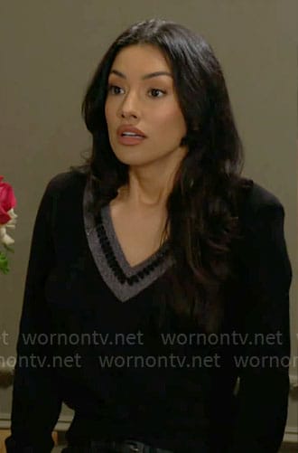 Audra’s black v-neck sweater with stripe trim on The Young and the Restless