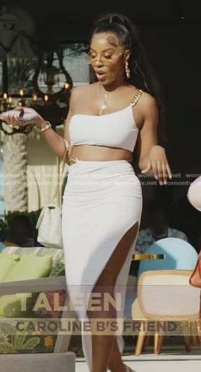 Caroline’s white cropped chain strap top and skirt on The Real Housewives of Dubai