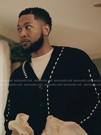 Emmett’s black contrast stitch cardigan on The Chi