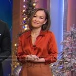 Eva’s orange satin shirt and brown belted pants on Good Morning America