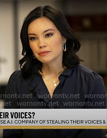 Jo Ling Kent’s navy scalloped trim top on CBS Mornings