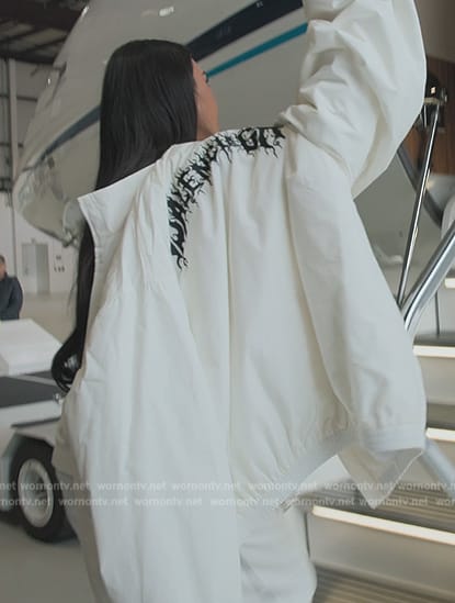 Kim’s white balenciaga jacket and snow boots on The Kardashians