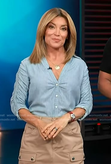 Kit’s ruched sleeve shirt and cargo mini skirt on Access Hollywood