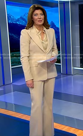 Norah’s satin blouse and beige suit on CBS Evening News