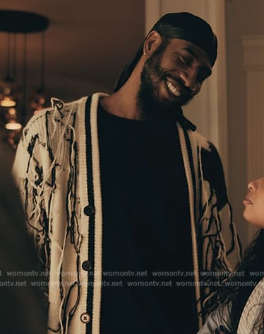 Robb’s white and black distressed cardigan on The Chi