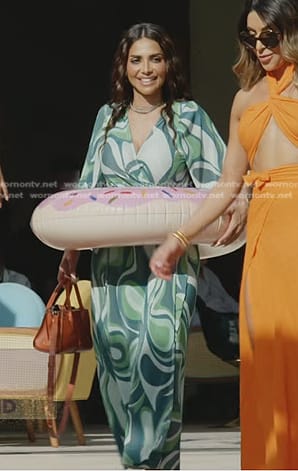 Sara’s green geometric print pleated wrap dress on The Real Housewives of Dubai