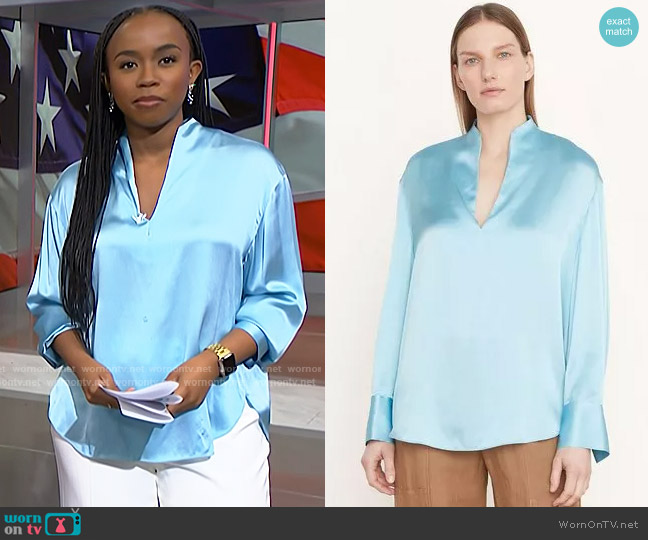 Vince Silk Long Sleeve Split-Neck Top in Light Lagoon worn by Zinhle Essamuah on NBC News Daily