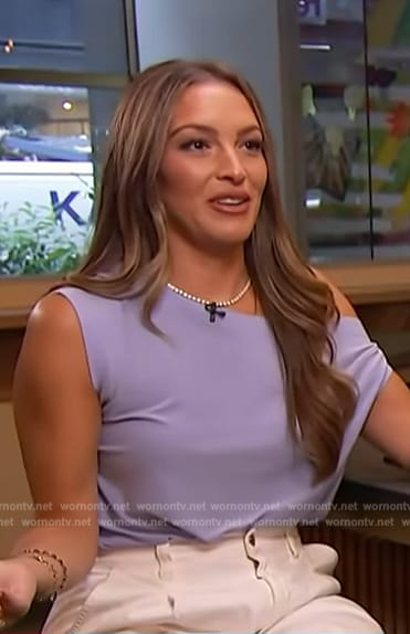 Emily Orozco’s blue one shoulder top on Access Hollywood