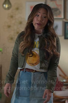 Esti’s peach graphic tee and denim skirt on UnPrisoned