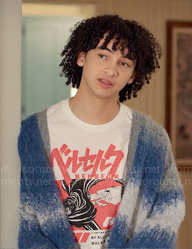 Finn’s Berserk graphic tee and blue cardigan on UnPrisoned