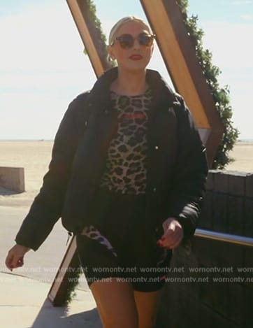 Gina’s black padded jacket and leopard print top on The Real Housewives of Orange County