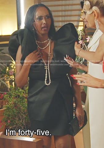Ifrah’s black ruffle v-neck dress on The Real Housewives of Dubai