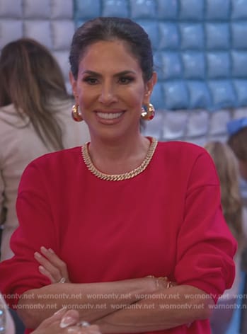 Jenn Fessler’s red chain neckline sweatshirt on The Real Housewives of New Jersey