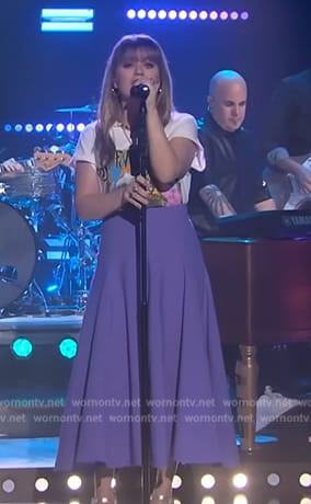 Kelly’s Stevie Nick graphic tee and purple skirt on The Kelly Clarkson Show