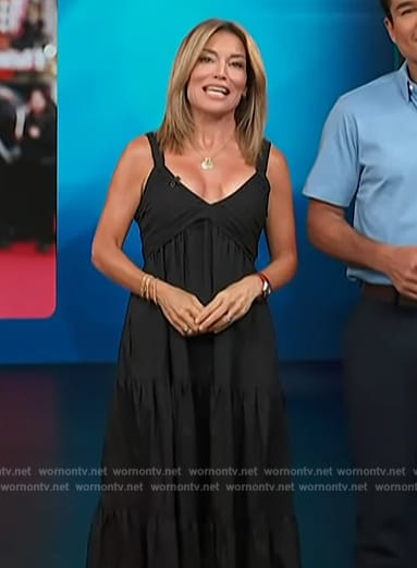 Kit’s black sleeveless midi dress on Access Hollywood