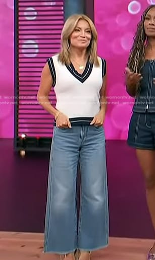 Kit’s white and navy v-neck vest and wide-leg jeans on Access Hollywood