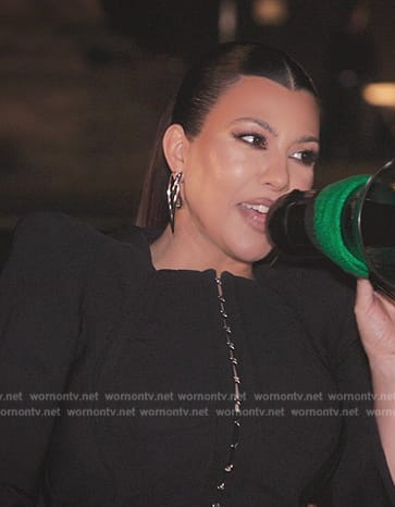 Kourtney’s black peplum jacket and mini skirt on The Kardashians