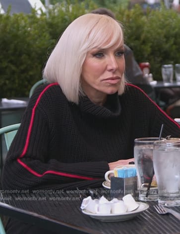Margaret’s black sleeve stripe sweater on The Real Housewives of New Jersey