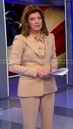 Norah’s satin blouse and beige suit on CBS Evening News